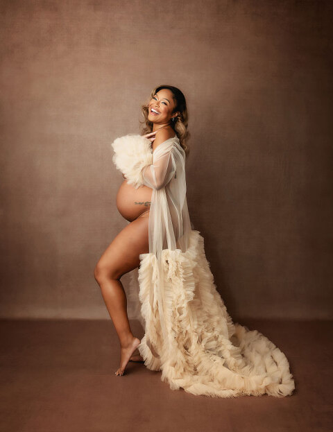 maternity photographer near Newnan, studio portrait of mom laughing in tulle robe
