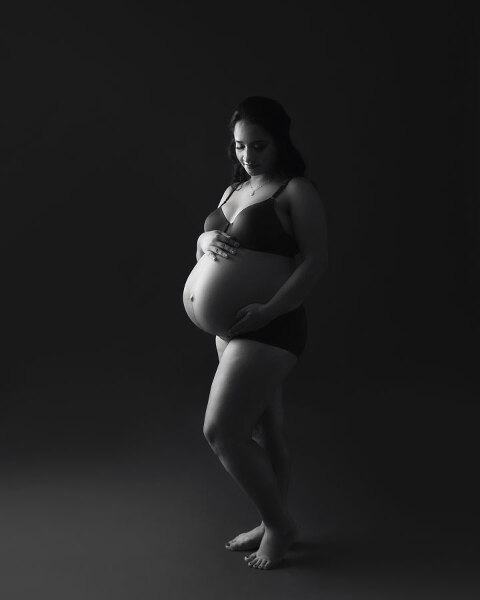 Villa Rica maternity photographer, dark studio portrait with dramatic lighting