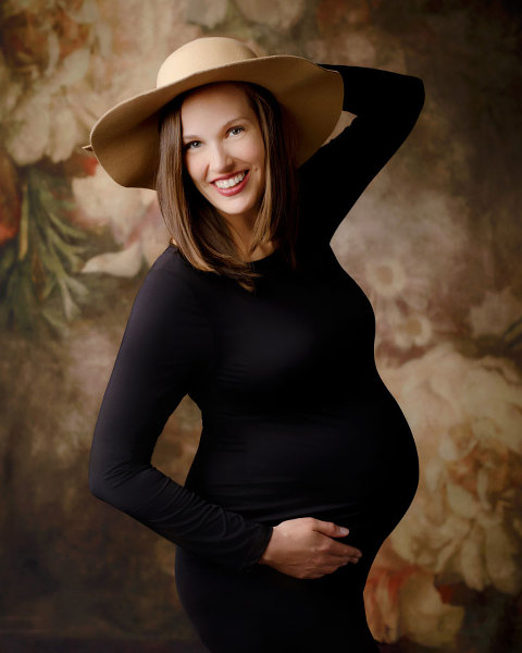 Carrollton maternity photographer in Georgia, mom in black dress and hat in studio