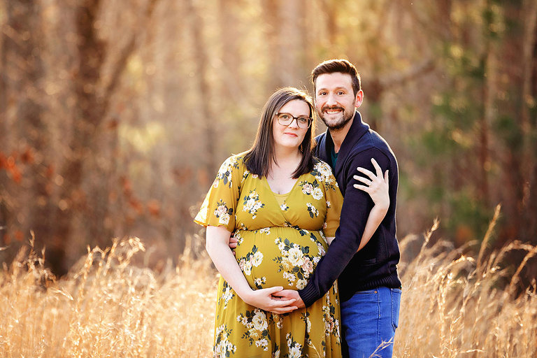 Villa Rica maternity photographer, expecting couple outside in field of tall grass