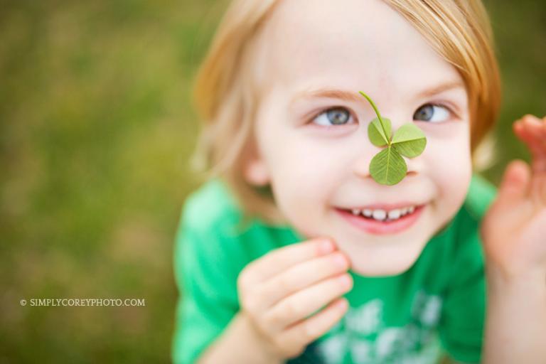 boy with a clover on his nose by Atlanta child photographer, Simply Corey Photography