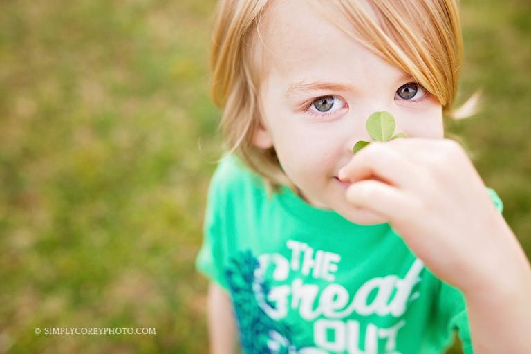 boy with a clover on his nose by Atlanta child photographer, Simply Corey Photography