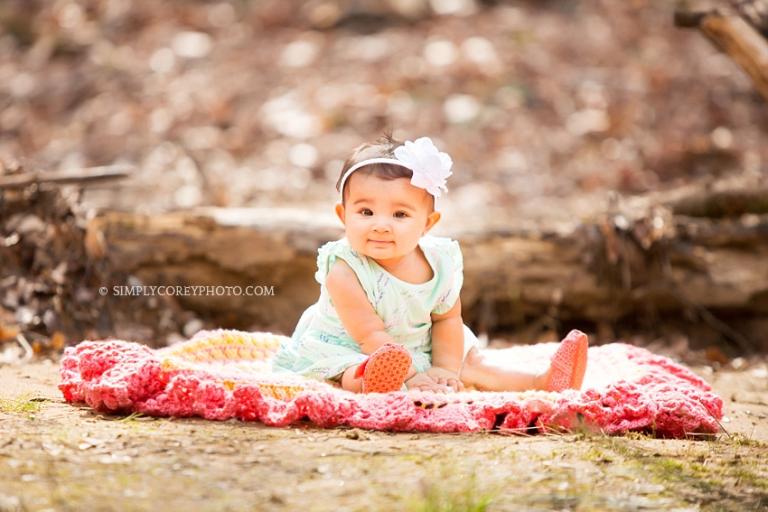 baby girl on a blanket during an outdoor photography session by Atlanta baby photographer