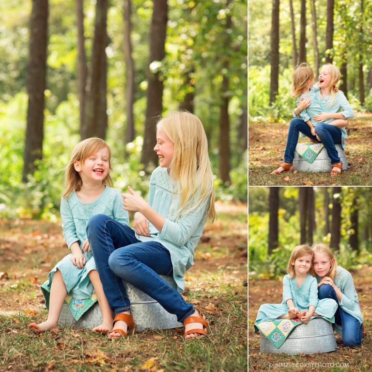 sisters laughing by Atlanta family photographer