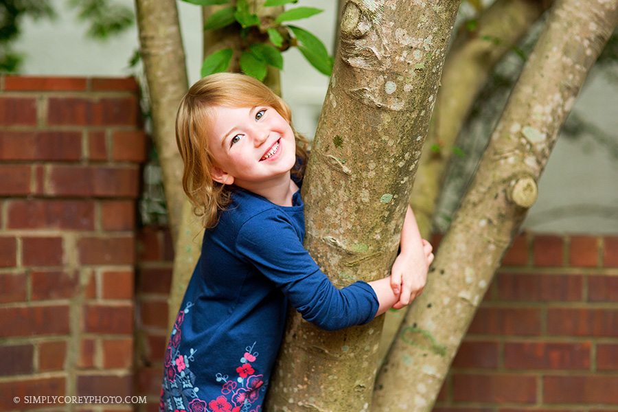 girl by a tree by Atlanta child photographer