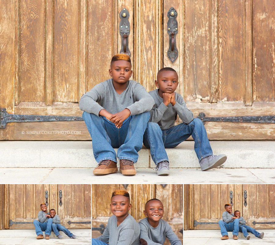 brothers by wooden doors at Berry College by Atlanta children's photographer
