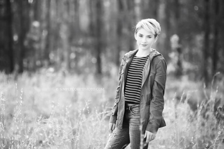 black and white photo of a teen girl in a field by Douglasville model photographer