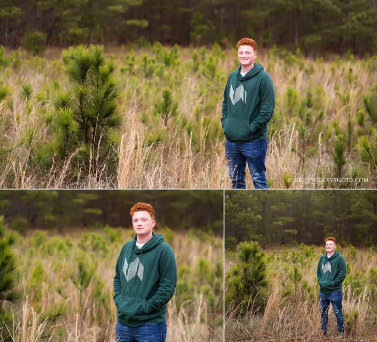 teen boy near pine trees by Carrollton senior portrait photographer