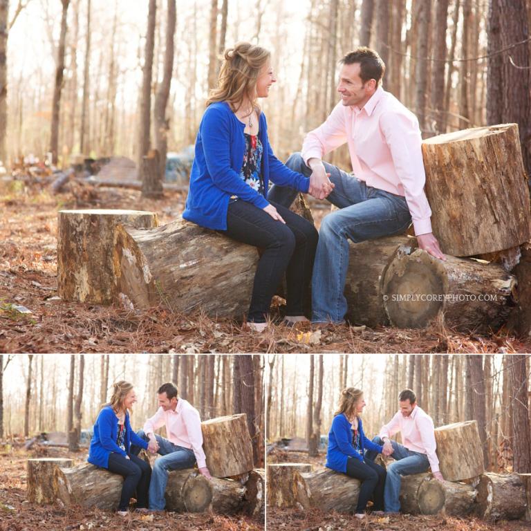 outdoor portraits of a couple sitting on logs by Newnan engagement photographer