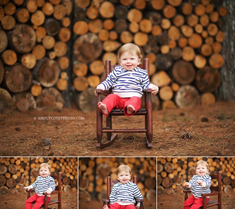 one year old in a rocking chair near a log pile by Atlanta baby photographer