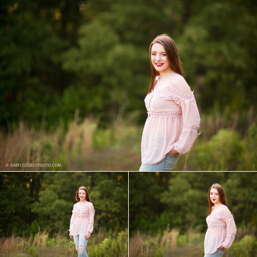 teen girl outside in a field by Douglasville senior portrait photographer