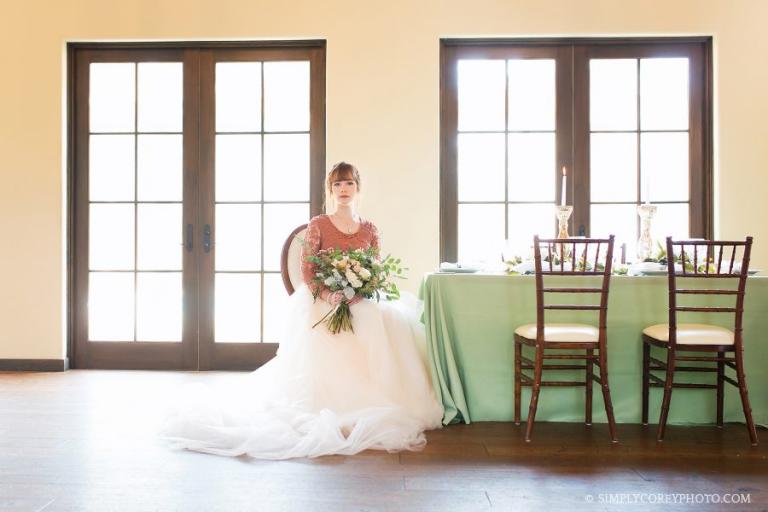 bride sitting at a table decorated by Eclectic Eventz at Tuscany Hills by Carrollton wedding photographer