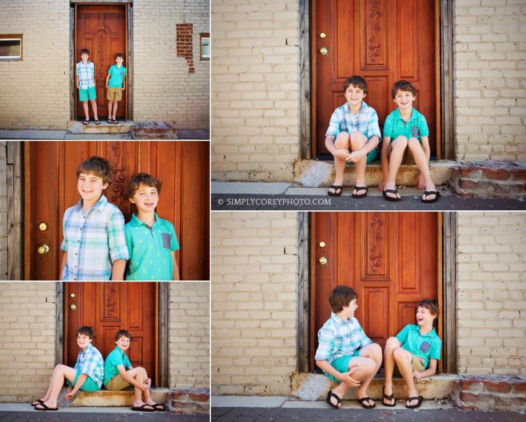 two brothers by a wood door by Douglasville children's photographer
