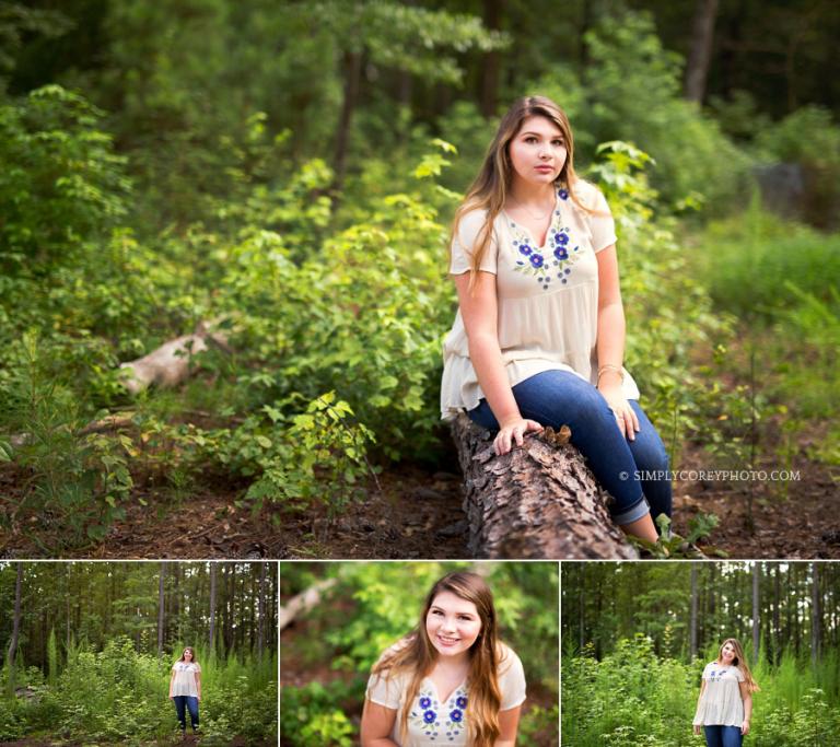teen sitting on a log by Newnan senior portrait photographer