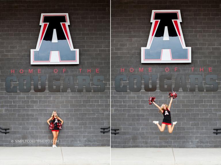 cheerleader jumping in front of Alexander High School sign by Douglasville senior portrait photographer