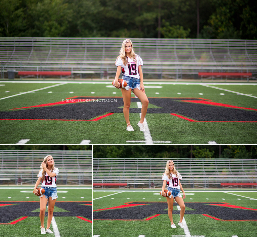 Alexander High School cheerleader with football on field by Douglasville teen photographer