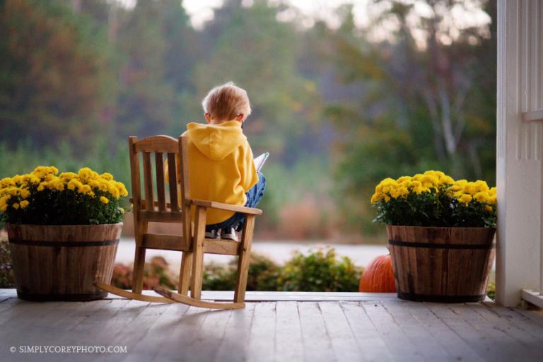 boy reading on front porch by Atlanta lifestyle photographer