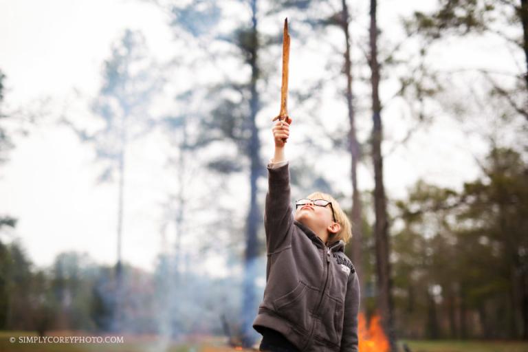 boy with stick sword by Carrollton, GA lifestyle photographer