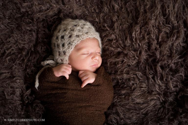 baby boy in brown hat by Carrollton newborn photographer