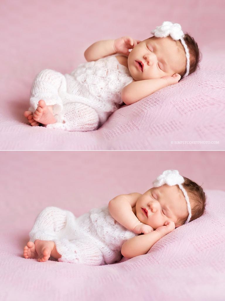 baby girl in a white romper on a pink blanket by Douglasville newborn photographer
