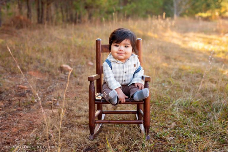 boy outdoors in a rocking chair by Atlanta baby photographer