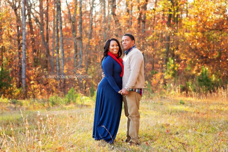 couple outside in a field by Douglasville engagement photographer