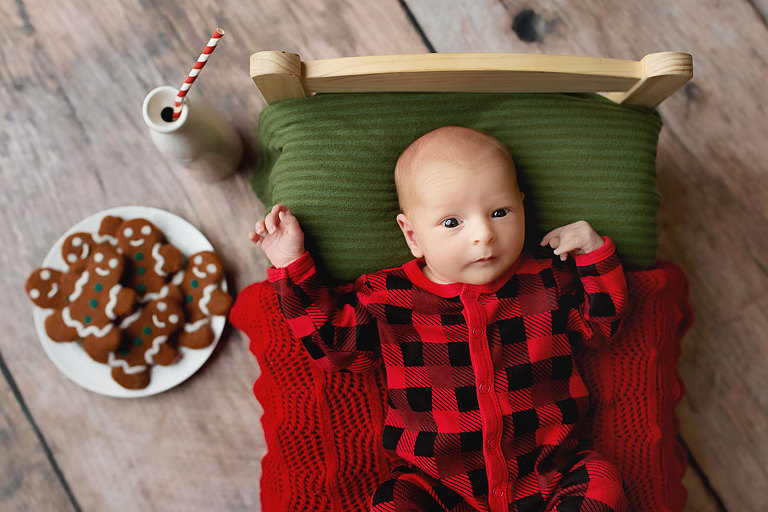 Hiram newborn photographer, baby boy in Christmas pajamas with cookies
