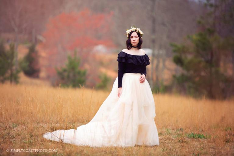Carrollton, GA senior portrait photographer, girl wearing a tulle skirt in a field