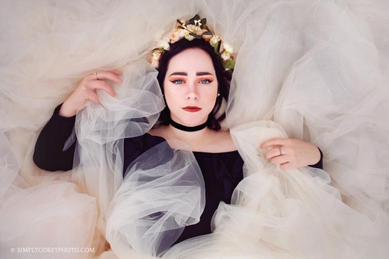 senior portrait photographer Carrollton, girl laying down on a tulle skirt