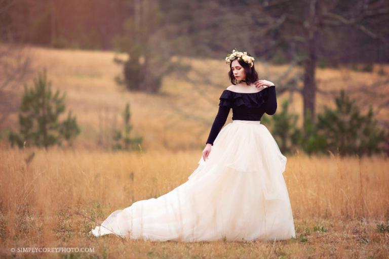 senior portrait photographer Newnan, girl in golden field with a tulle skirt and flower crown