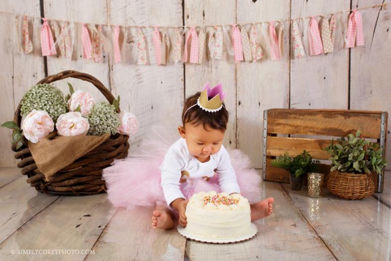 Newnan cake smash photographer, baby girl with a pink tutu and flowers