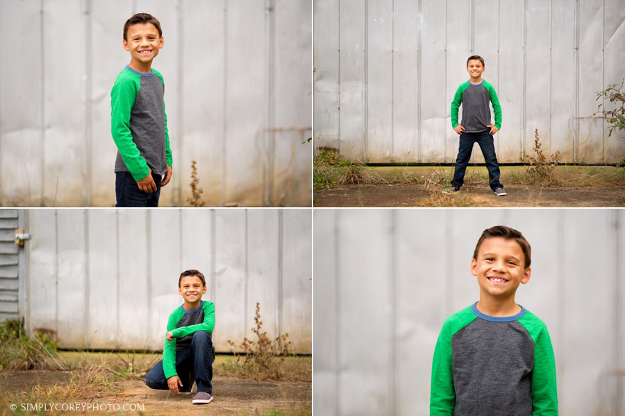 Douglasville children's photographer, tween boy outside a barn 
