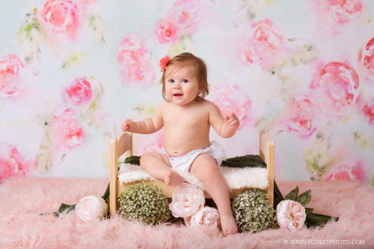 Atlanta baby photographer, baby girl on a bed with pink flowers