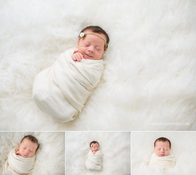 Douglasville newborn photographer, baby girl on off white fur
