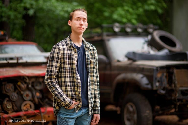 Douglasville senior portrait photographer, teen guy outside with jeeps