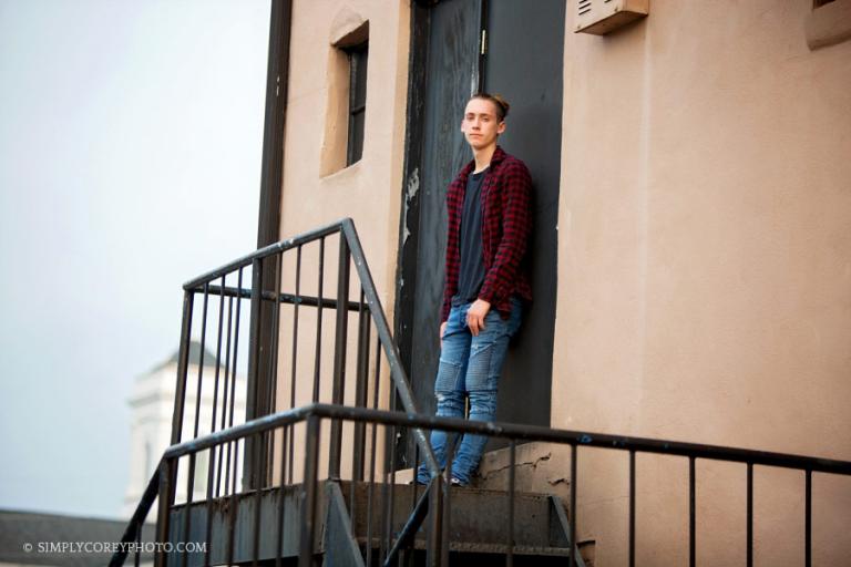 senior portrait photographer Atlanta, teen boy by a black door