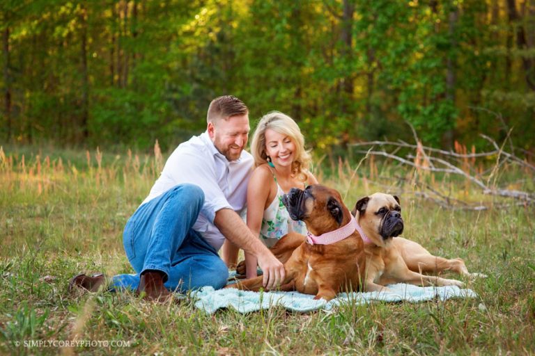 family photographer Newnan, couples with dogs on a blanket outside