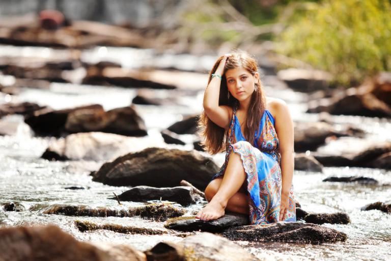 senior portrait photographer Atlanta, teen girl on rocks in water