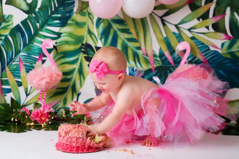 Newnan cake smash photographer, girl in pink tutu with a tropical flamingo studio theme