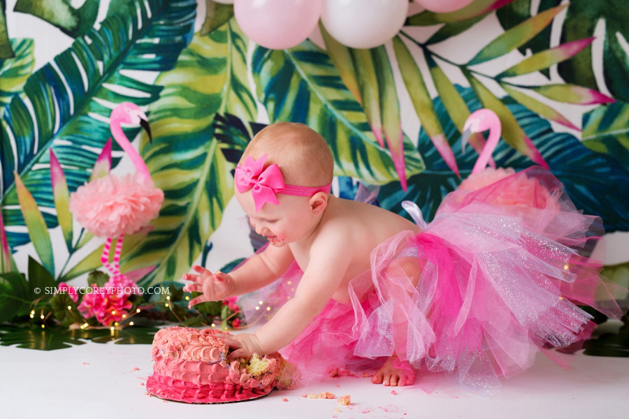 Newnan cake smash photographer, girl in pink tutu with a tropical flamingo studio theme