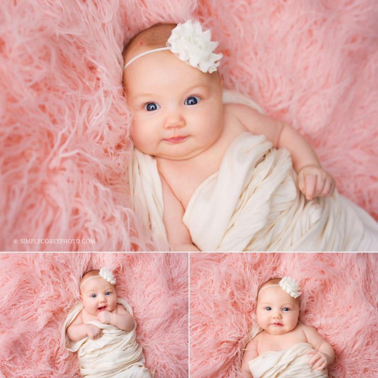 Douglasville baby photographer; 2 month old baby girl on pink fur