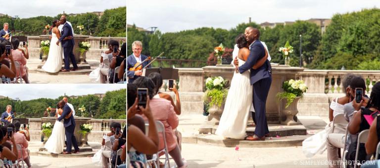 kiss during ceremony at Millennium Gate , wedding photography Atlanta