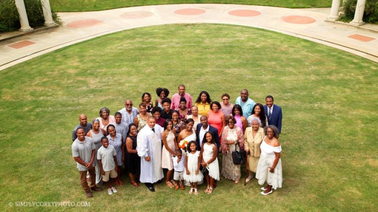 wedding guests group photo on Millennium Gate Museum lawn in Atlanta