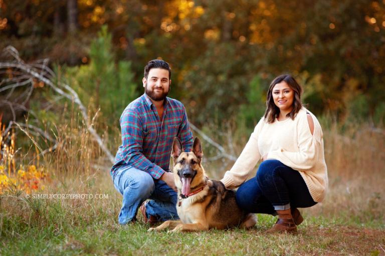 Douglasville family photographer, couple outside with a big dog