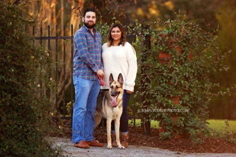 Newnan pet photographer, family fall portrait by a gate outside