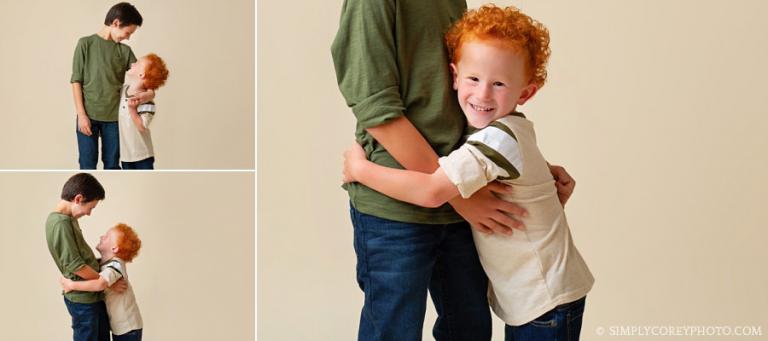 Atlanta family photographer, brothers hugging in studio