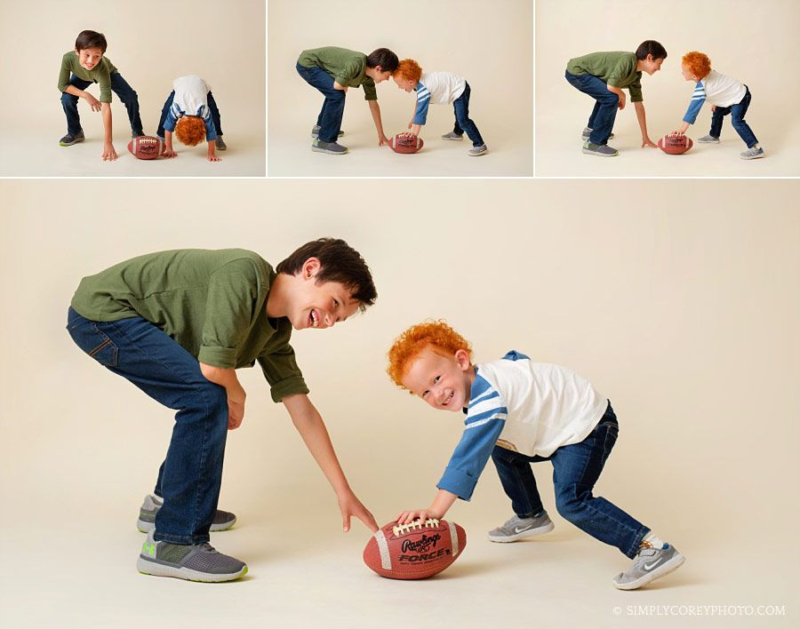 Bremen children's photographer, brothers playing football in studio