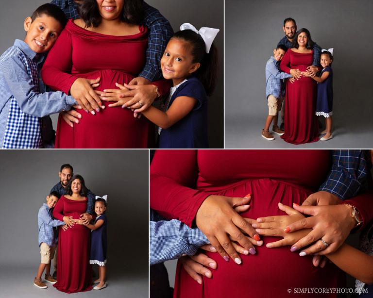 Villa Rica maternity photographer, family with hands on pregnant belly