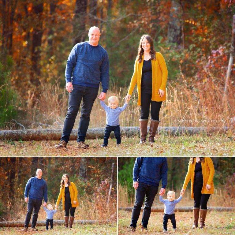 Carrollton family photographer, parents holding baby's hands outside