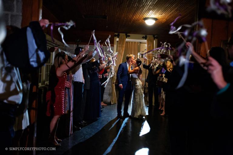 Atlanta wedding photographer, exit with streamers inside Piedmont Room